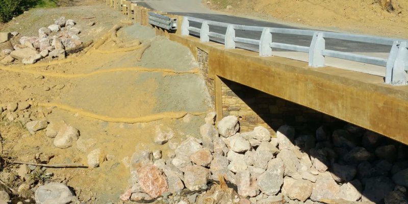 A bridge is being built over a river.