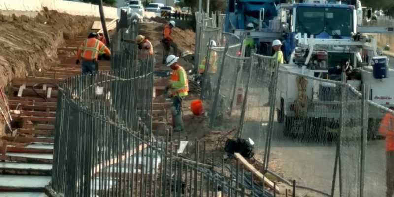 Workers are working on a construction site.