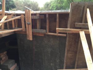 A house is being built with wooden beams.