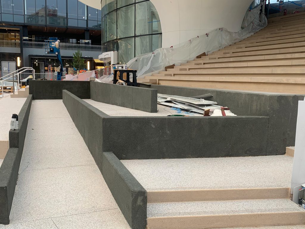 A concrete staircase is being built in front of a building.