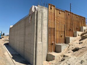 A concrete wall with wooden slats on it